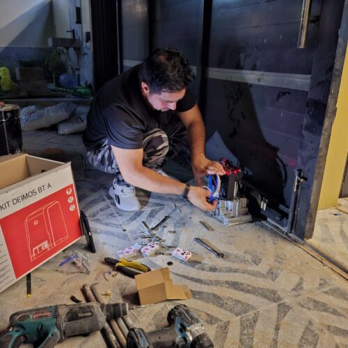 technician repairing bft sliding gate motor in dubai
